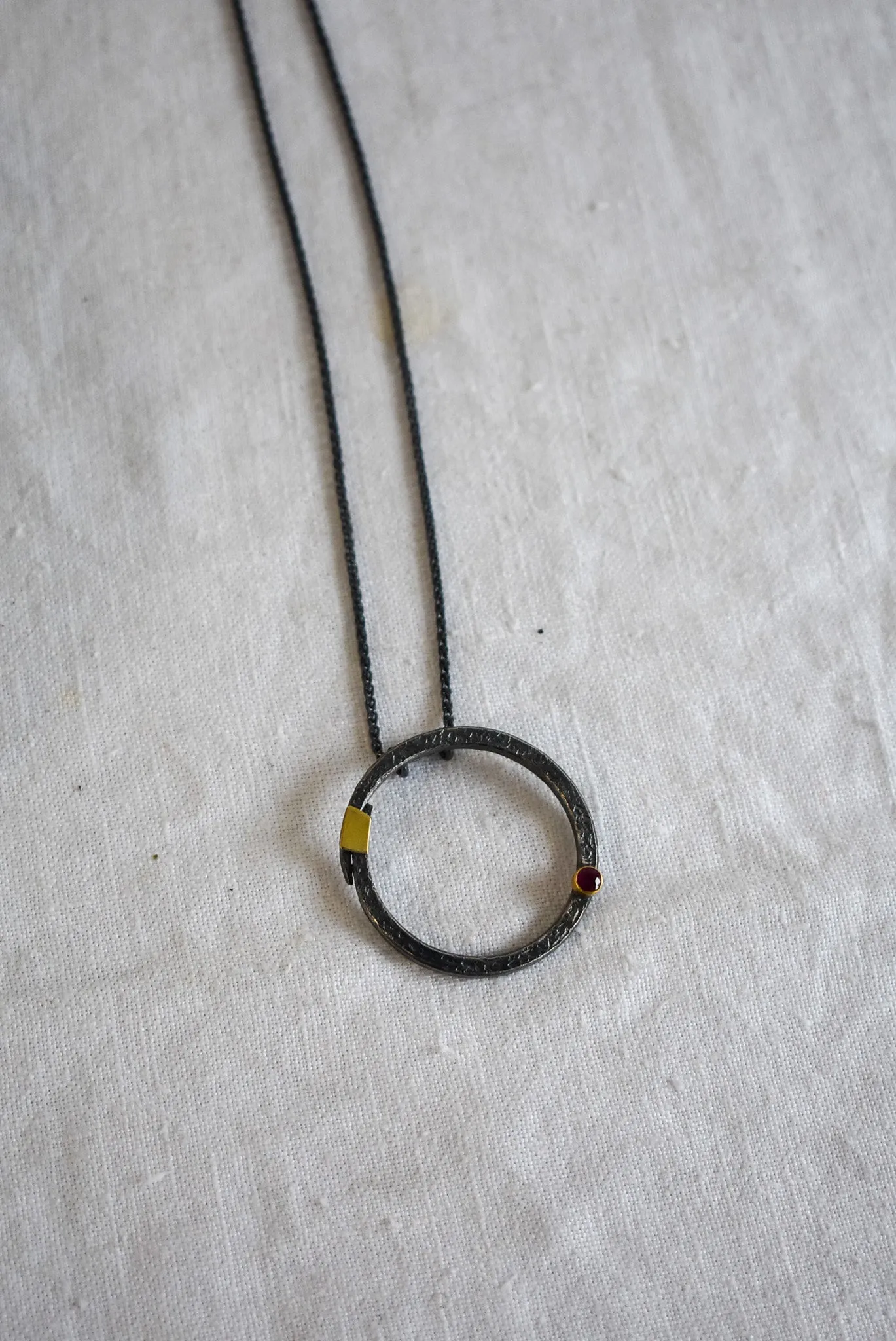 Bob Wyber Silver   22ct Gold set ruby small circle necklace