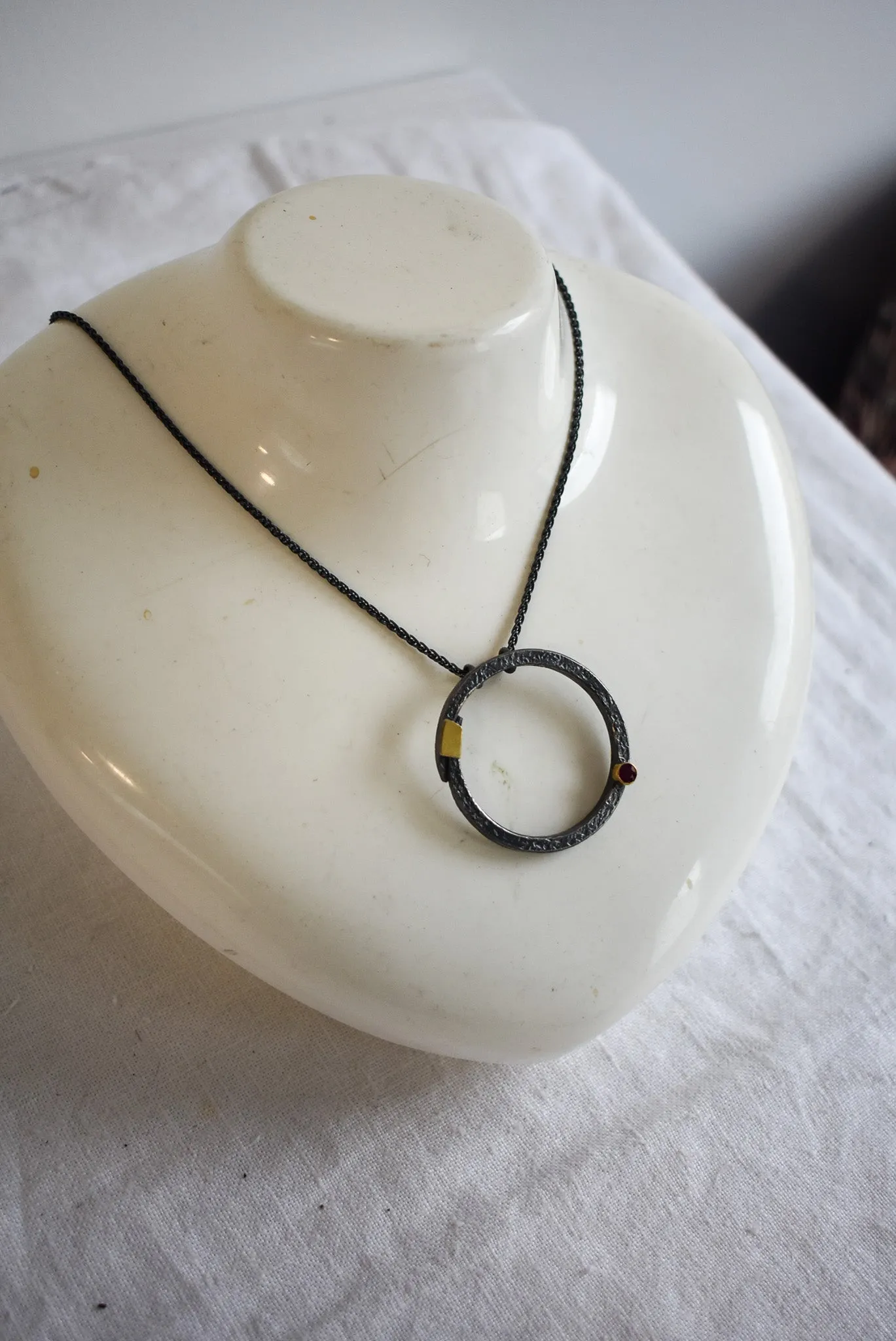 Bob Wyber Silver   22ct Gold set ruby small circle necklace
