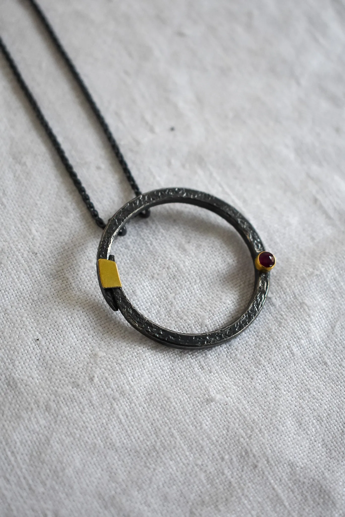 Bob Wyber Silver   22ct Gold set ruby small circle necklace