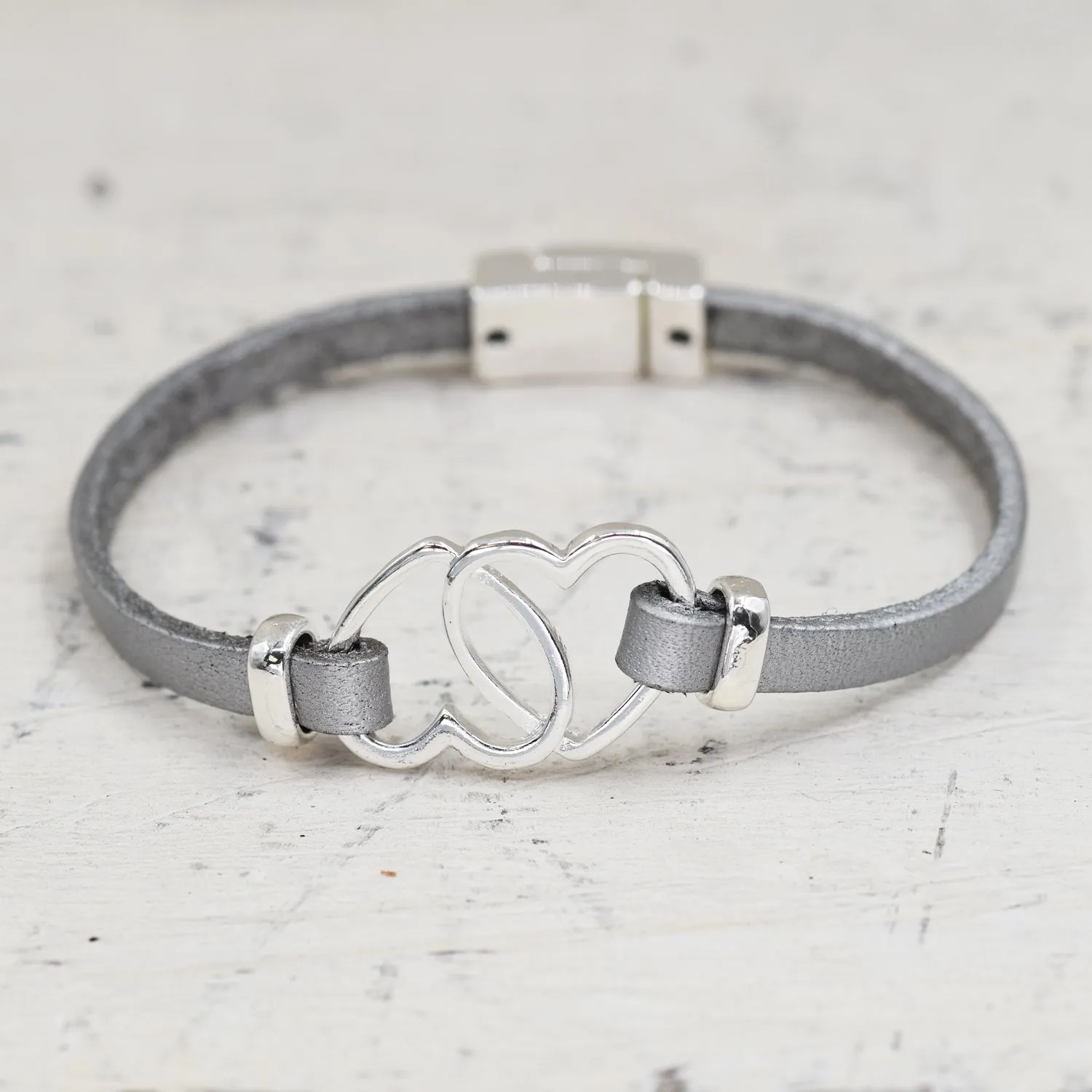 Entwined hearts on simple leather bracelet w/mag clasp